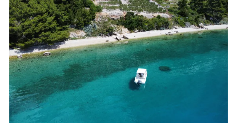 Drone photo in a wild bay of a boat trip